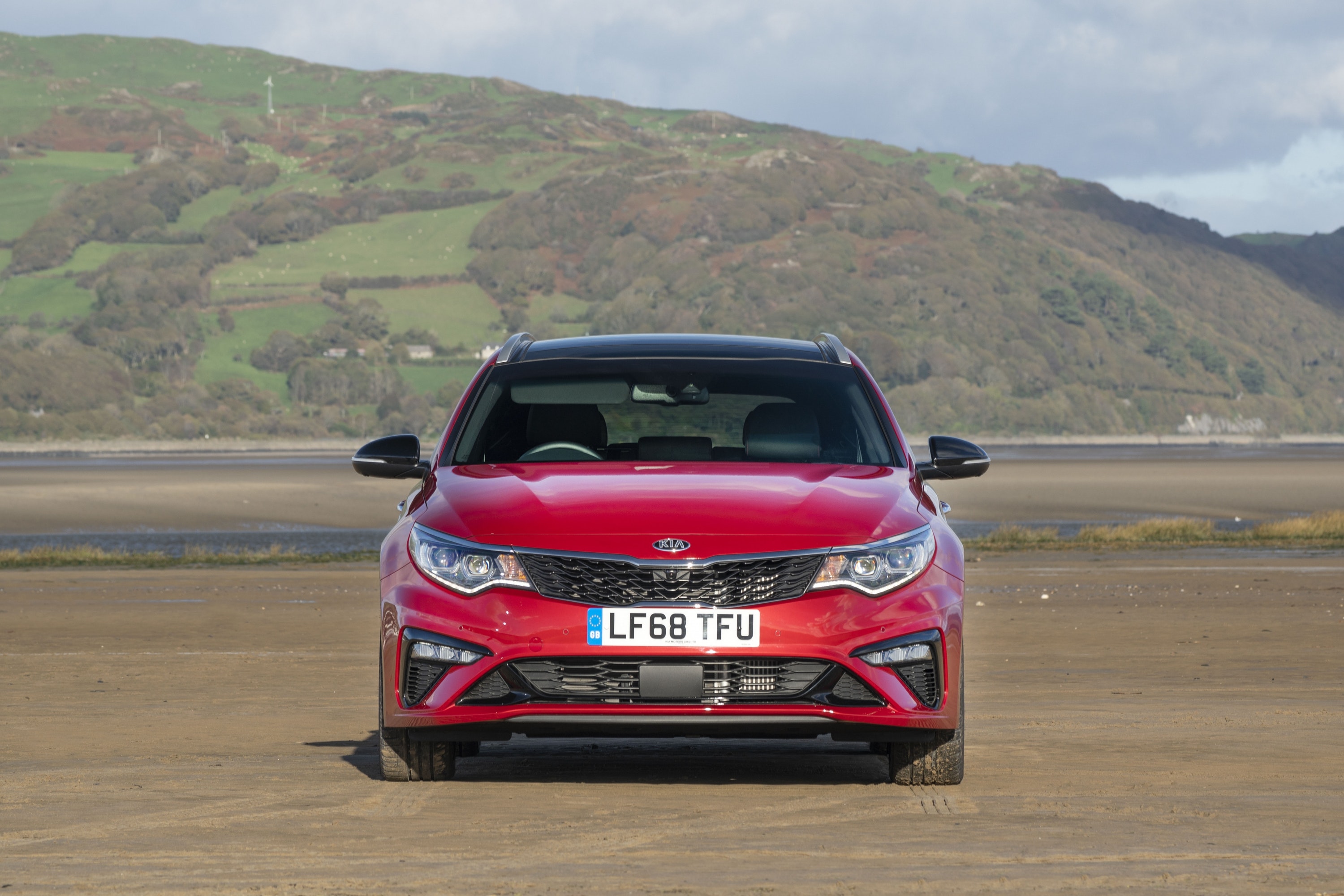 Front of a red Kia Optima Sportswagon